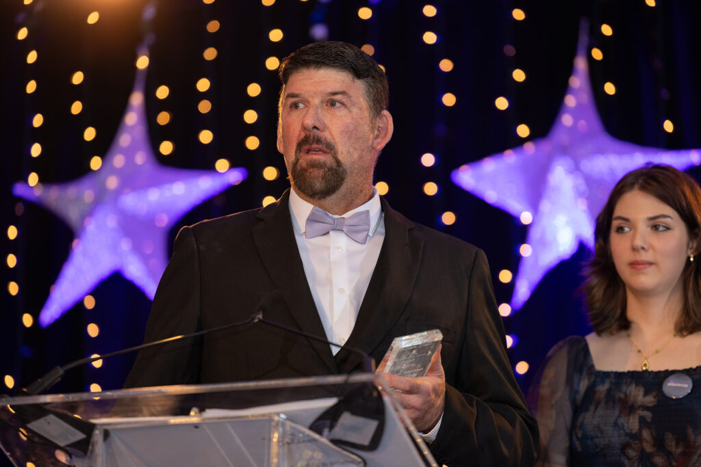 TOm WHitehead delivering speech after accepting the Beacon of Hope award